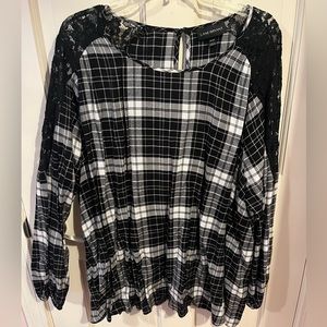 Black and white plaid long sleeve blouse with lace sleeves.